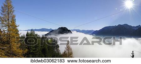 "View from the ruins of Falkenstein Castle over the mist-covered Vilser Tal or Vils Valley and Zwoelferkogel mountain near Fuessen, Falkenstein, Allgau, Swabia, Bavaria, Germany, Europe" View Large Photo Image Stock Image - "View from the ruins of Falkenstein Castle over the mist-covered Vilser Tal or Vils Valley and Zwoelferkogel mountain near Fuessen, Falkenstein, Allgau, Swabia, Bavaria, Germany, Europe". Fotosearch