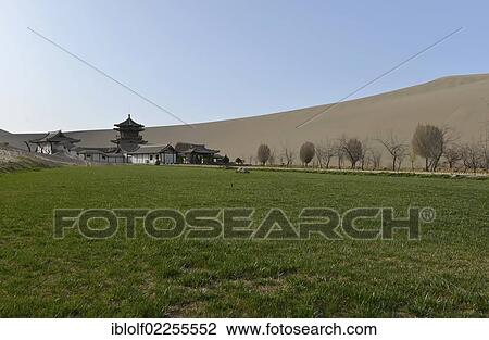 "View from the sand dunes of the Gobi Desert to the Crescent Lake with a Chinese pagoda and a small green park near Dunhuang, Silk Road, Gansu, China, Asia" View Large Photo Image Stock Image - "View from the sand dunes of the Gobi Desert to the Crescent Lake with a Chinese pagoda and a small green park near Dunhuang, Silk Road, Gansu, China, Asia". Fotosearch