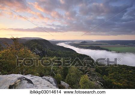 "View from the Schrammsteine rocks over the Elbe Valley towards Zirkelstein and Kaiserkrone in autumn at sunrise, Elbe Sandstone Mountains, Saxon Switzerland region, Saxony, Germany, Europe" View Large Photo Image Picture - "View from the Schrammsteine rocks over the Elbe Valley towards Zirkelstein and Kaiserkrone in autumn at sunrise, Elbe Sandstone Mountains, Saxon Switzerland region, Saxony, Germany, Europe". Fotosearch