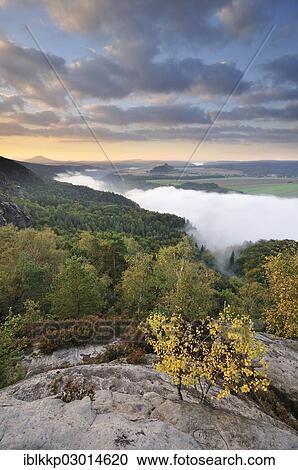 "View from the Schrammsteine rocks over the Elbe Valley towards Zirkelstein and Kaiserkrone in autumn at sunrise, Elbe Sandstone Mountains, Saxon Switzerland region, Saxony, Germany, Europe" View Large Photo Image Stock Image - "View from the Schrammsteine rocks over the Elbe Valley towards Zirkelstein and Kaiserkrone in autumn at sunrise, Elbe Sandstone Mountains, Saxon Switzerland region, Saxony, Germany, Europe". Fotosearch