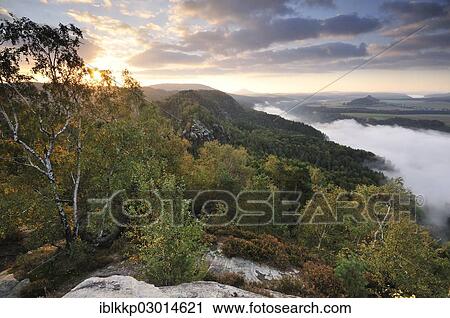 "View from the Schrammsteine rocks over the Elbe Valley towards Zirkelstein and Kaiserkrone in autumn at sunrise, Elbe Sandstone Mountains, Saxon Switzerland region, Saxony, Germany, Europe" View Large Photo Image Stock Image - "View from the Schrammsteine rocks over the Elbe Valley towards Zirkelstein and Kaiserkrone in autumn at sunrise, Elbe Sandstone Mountains, Saxon Switzerland region, Saxony, Germany, Europe". Fotosearch