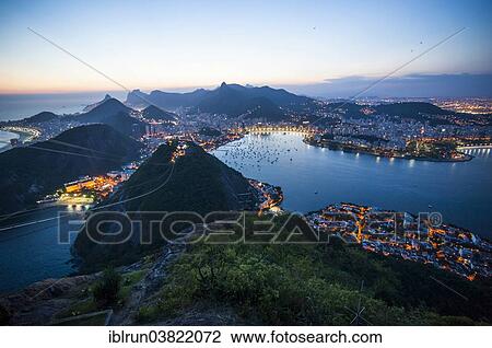 Stock Image - "View from the Sugarloaf Mountain or Pao de Acucar at sunset, Rio de Janeiro, Brazil, South America". Fotosearch
