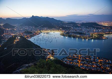 Stock Image - "View from the Sugarloaf Mountain or Pao de Acucar at sunset, Rio de Janeiro, Brazil, South America". Fotosearch