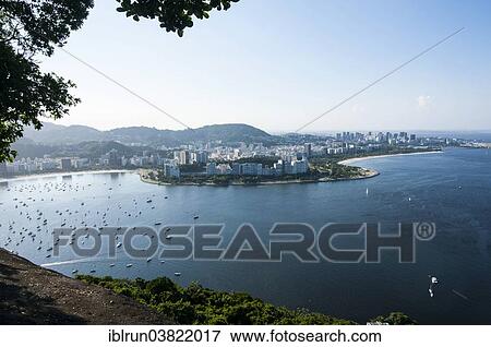 Stock Photo - "View from the Sugarloaf Mountain or Pao de Acucar over Rio de Janeiro, Brazil, South America". Fotosearch