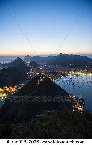 "View from the Sugarloaf Mountain or Pao de Acucar at sunset, Rio de Janeiro, Brazil, South America" View Large Photo Image Stock Photograph - "View from the Sugarloaf Mountain or Pao de Acucar at sunset, Rio de Janeiro, Brazil, South America". Fotosearch