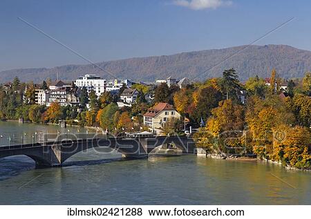 Stock Photo - View from the tower of the city hall of Rheinfelden - AG, looking westwards over the rooftops of Rheinfelden - AG towards the Rheinbruecke bridge and the Haus Salmegg building, Rheinfelden - AG, canton of Aargau, Switzerland, Europe. Fotosearch