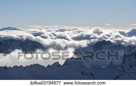 "View from the Zugspitze, clouds gather over the mountain peaks, Zugspitze, Bavaria, Germany, Europe" View Large Photo Image Stock Photo - "View from the Zugspitze, clouds gather over the mountain peaks, Zugspitze, Bavaria, Germany, Europe". Fotosearch