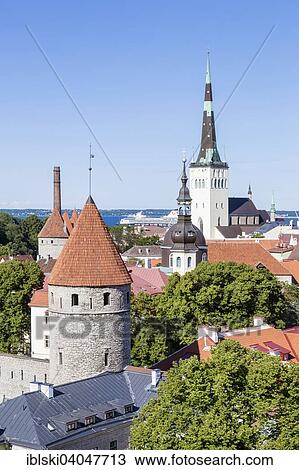 Stock Image - "View from Toompea Hill on the Lower Town, old town with the St. Olaf's Church or Oleviste kirik, and the towers of the city walls, Tallinn, Estonia, Europe". Fotosearch
