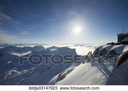 "View from Zugspitze Mountain past the Zugspitze weather station towards the west, Zugspitze, Wetterstein mountain range, Eastern Alps, Upper Bavaria, Bavaria, Germany, Europe" View Large Photo Image Stock Image - "View from Zugspitze Mountain past the Zugspitze weather station towards the west, Zugspitze, Wetterstein mountain range, Eastern Alps, Upper Bavaria, Bavaria, Germany, Europe". Fotosearch
