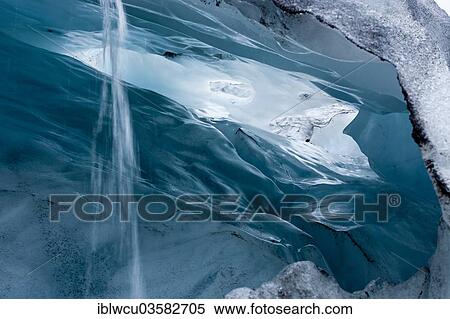 "View into a blue-green ice cave with condensation water draining off, Skaftafell Glacier, Iceland, Europe" View Large Photo Image Stock Photography - "View into a blue-green ice cave with condensation water draining off, Skaftafell Glacier, Iceland, Europe". Fotosearch
