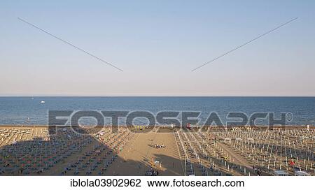 "View of a beach with sunshades and sun beds in the late afternoon, 5 pm, image 8 of 9, Lignano Sabbiadoro, Udine province, Adriatic Coast, Italy, Europe" View Large Photo Image Stock Image - "View of a beach with sunshades and sun beds in the late afternoon, 5 pm, image 8 of 9, Lignano Sabbiadoro, Udine province, Adriatic Coast, Italy, Europe". Fotosearch