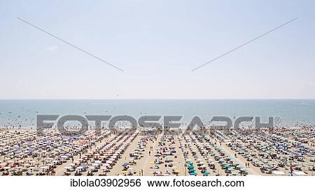 "View of a beach with sunshades and sun beds, at noon, image 6 of 9, Lignano Sabbiadoro, Udine province, Adriatic Coast, Italy, Europe" View Large Photo Image Stock Photograph - "View of a beach with sunshades and sun beds, at noon, image 6 of 9, Lignano Sabbiadoro, Udine province, Adriatic Coast, Italy, Europe". Fotosearch