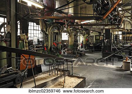 "View of a drop-forging workshop with three powerful screw presses, formerly the factory of Dietz and Pfriem, 1911, today an industrial museum, Lauf, Middle Franconia, Bavaria, Germany, Europe" View Large Photo Image Stock Photograph - "View of a drop-forging workshop with three powerful screw presses, formerly the factory of Dietz and Pfriem, 1911, today an industrial museum, Lauf, Middle Franconia, Bavaria, Germany, Europe". Fotosearch