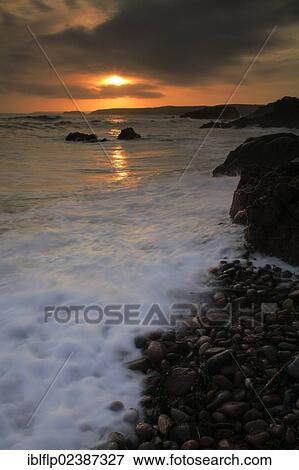 "View of beach and sea at sunset, Freshwater Bay, Pembrokeshire National Park, Pembrokeshire, Wales, United Kingdom, Europe" View Large Photo Image Stock Photo - "View of beach and sea at sunset, Freshwater Bay, Pembrokeshire National Park, Pembrokeshire, Wales, United Kingdom, Europe". Fotosearch