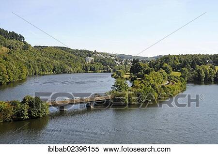 "View of Biggetalsperre dam and Biggesee as seen from Talbruecke Ronnewinkel bridge, Olpe, Ebbegebirge nature park Park, Sauerland, North Rhine-Westphalia, Germany, Europe, PublicGround, Europe" View Large Photo Image Stock Photography - "View of Biggetalsperre dam and Biggesee as seen from Talbruecke Ronnewinkel bridge, Olpe, Ebbegebirge nature park Park, Sauerland, North Rhine-Westphalia, Germany, Europe, PublicGround, Europe". Fotosearch