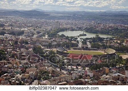 "View of city with sports stadium and lake, Lake Anosy, Antananarivo, Analamanga Region, Antananarivo Province, Central Madagascar, Africa" View Large Photo Image Stock Photo - "View of city with sports stadium and lake, Lake Anosy, Antananarivo, Analamanga Region, Antananarivo Province, Central Madagascar, Africa". Fotosearch
