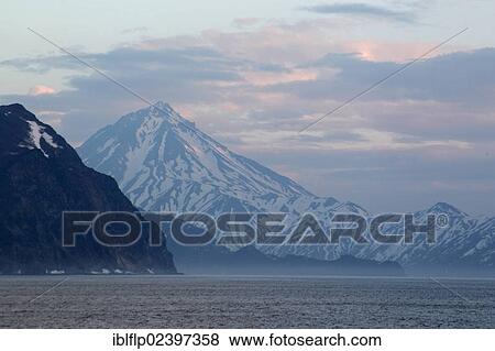 "View of coastline with snow covered mountains, Bukhta Russkiya, Kamchatka Peninsula, Kamchatka Krai, Russian Far East, Russia, Europe" View Large Photo Image Stock Photo - "View of coastline with snow covered mountains, Bukhta Russkiya, Kamchatka Peninsula, Kamchatka Krai, Russian Far East, Russia, Europe". Fotosearch