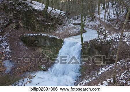 "View of frozen waterfall and river in forest habitat, Sirzenicher Bach creek, Rhineland-Palatinate, Germany, Europe" View Large Photo Image Stock Photograph - "View of frozen waterfall and river in forest habitat, Sirzenicher Bach creek, Rhineland-Palatinate, Germany, Europe". Fotosearch