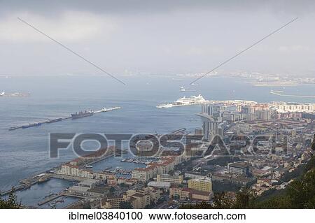 "View of Gibraltar with its harbour and Bay of Gibraltar from Rock of Gibraltar, British Overseas Territory of Gibraltar" View Large Photo Image Stock Image - "View of Gibraltar with its harbour and Bay of Gibraltar from Rock of Gibraltar, British Overseas Territory of Gibraltar". Fotosearch
