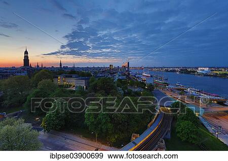 "View of Hamburg and the Elbe River with the Elbbrucken underground station, the Sintfang Youth Hostel, the Elbe Philharmonic Hall and the main churches, at sunrise, Hamburg, Germany, Europe" View Large Photo Image Stock Photo - "View of Hamburg and the Elbe River with the Elbbrucken underground station, the Sintfang Youth Hostel, the Elbe Philharmonic Hall and the main churches, at sunrise, Hamburg, Germany, Europe". Fotosearch