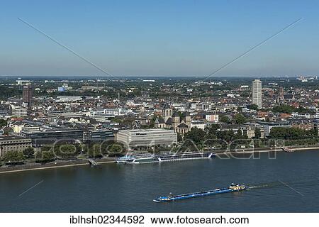 "View of Neustadt Nord district and the Rhine river as seen from Deutz, cargo ships floating on the Rhine river, Cologne, North Rhine-Westphalia, Germany, Europe" View Large Photo Image Stock Image - "View of Neustadt Nord district and the Rhine river as seen from Deutz, cargo ships floating on the Rhine river, Cologne, North Rhine-Westphalia, Germany, Europe". Fotosearch