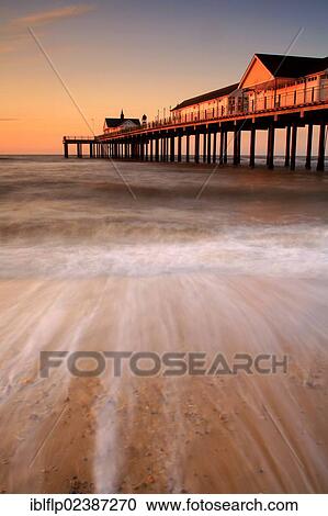 Stock Image - "View of restored pier at sunrise, Southwold Pier, Southwold, Suffolk, England, United Kingdom, Europe". Fotosearch