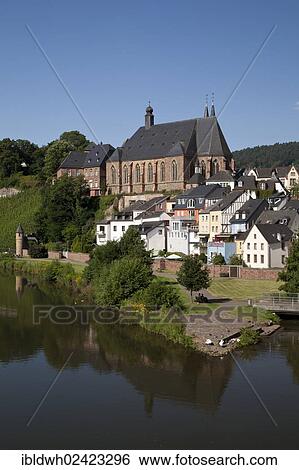 Stock Photograph - View of Saarburg with parish church of St. Laurentius, Saarburg, Saar river, Rhineland-Palatinate, Germany, Europe, PublicGround, Europe. Fotosearch