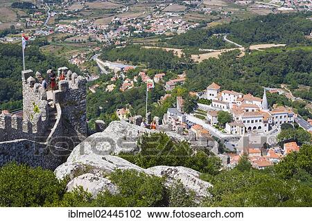 Stock Image - "View of Sintra National Palace, Palacio Nacional de Sintra, Town Palace, Palacio da Vila from Moorish Castle, Castle of the Moors, Castelo dos Mouros, Sintra Cascais Natural Park, Grande Lisboa, Lisbon Region, Portugal, Europe". Fotosearch