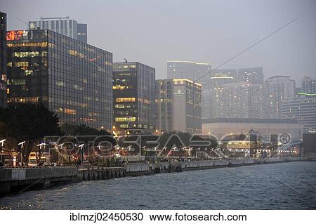 "View of skyscrapers and Victoria Harbour in the evening, Tsim Sha Tsui, Kowloon, Hong Kong, China, Asia" View Large Photo Image Stock Image - "View of skyscrapers and Victoria Harbour in the evening, Tsim Sha Tsui, Kowloon, Hong Kong, China, Asia". Fotosearch