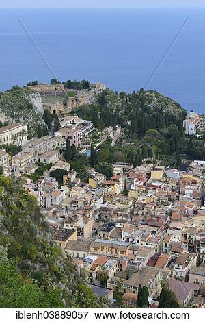 Stock Photo - "View of Taormina with the Teatro Greco, Greek Theatre, Taormina, Province of Messina, Sicily, Italy, Europe". Fotosearch