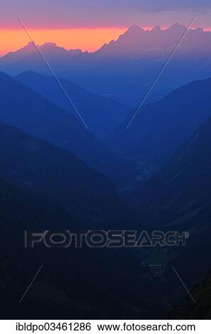 "View of the Bischofsmutzen peaks, left, and the Dachstein range, right, past the Obertal valley in evening light, Schladminger Tauern range, Styria, Austria, Europe" View Large Photo Image Stock Photograph - "View of the Bischofsmutzen peaks, left, and the Dachstein range, right, past the Obertal valley in evening light, Schladminger Tauern range, Styria, Austria, Europe". Fotosearch