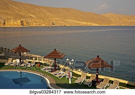 "View of the coast of the Musandram Peninsula from the swimming pool area at the Golden Tulip Resort Hotel, Khasab, Musandam Governorate, Oman, Asia" View Large Photo Image Stock Photo - "View of the coast of the Musandram Peninsula from the swimming pool area at the Golden Tulip Resort Hotel, Khasab, Musandam Governorate, Oman, Asia". Fotosearch
