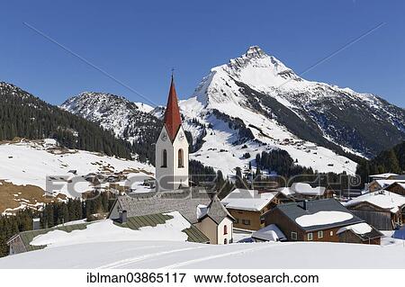 "View of the community of Warth, Bregenz Forest, Vorarlberg, at the back Mt Biberkopf in Tyrol, Austria, Europe" View Large Photo Image Stock Photo - "View of the community of Warth, Bregenz Forest, Vorarlberg, at the back Mt Biberkopf in Tyrol, Austria, Europe". Fotosearch