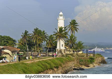 Stock Photograph - "View of the fortification wall and the lighthouse, UNESCO World Heritage Site, Galle Fort, Galle, Southern Province, Sri Lanka, Asia". Fotosearch