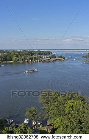 "View of the Mueritz river as seen from the steeple of Marienkirche church, Roebel, Mecklenburg Lake District, Mecklenburg-Western Pomerania, Germany, Europe" View Large Photo Image Stock Photo - "View of the Mueritz river as seen from the steeple of Marienkirche church, Roebel, Mecklenburg Lake District, Mecklenburg-Western Pomerania, Germany, Europe". Fotosearch