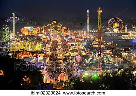 "View of the Oktoberfest festival at night, with illuminated stalls, beer tents and funfair rides, Oktoberfest festival, Munich, Upper Bavaria, Bavaria, Germany, Europe" View Large Photo Image Picture - "View of the Oktoberfest festival at night, with illuminated stalls, beer tents and funfair rides, Oktoberfest festival, Munich, Upper Bavaria, Bavaria, Germany, Europe". Fotosearch