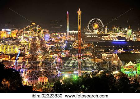 "View of the Oktoberfest festival at night, with illuminated stalls, beer tents and funfair rides, Oktoberfest festival, Munich, Upper Bavaria, Bavaria, Germany, Europe" View Large Photo Image Stock Image - "View of the Oktoberfest festival at night, with illuminated stalls, beer tents and funfair rides, Oktoberfest festival, Munich, Upper Bavaria, Bavaria, Germany, Europe". Fotosearch