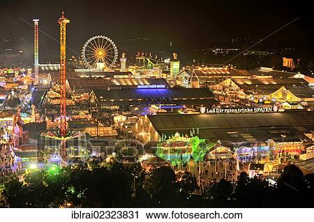 "View of the Oktoberfest festival at night, with illuminated stalls, beer tents and funfair rides, Oktoberfest festival, Munich, Upper Bavaria, Bavaria, Germany, Europe" View Large Photo Image Stock Image - "View of the Oktoberfest festival at night, with illuminated stalls, beer tents and funfair rides, Oktoberfest festival, Munich, Upper Bavaria, Bavaria, Germany, Europe". Fotosearch