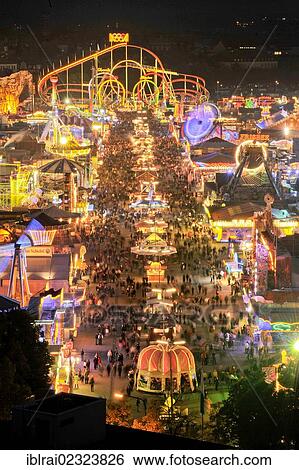 "View of the Oktoberfest festival at night, with illuminated stalls, beer tents and funfair rides, Oktoberfest festival, Munich, Upper Bavaria, Bavaria, Germany, Europe" View Large Photo Image Stock Photograph - "View of the Oktoberfest festival at night, with illuminated stalls, beer tents and funfair rides, Oktoberfest festival, Munich, Upper Bavaria, Bavaria, Germany, Europe". Fotosearch