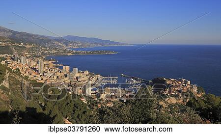 Stock Image - "View of the Principality of Monaco, from underneath the Tete du Chien, Mediterranean". Fotosearch