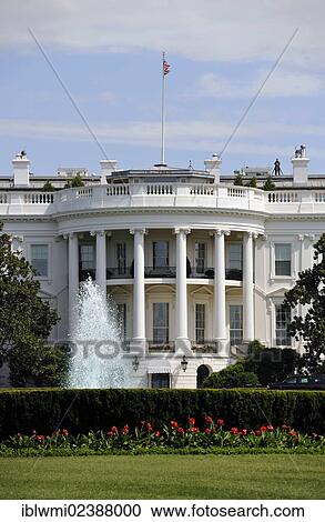 Stock Image - "View of the South Portico with the Blue Room, The White House, with security officer on the roof, Washington DC, District of Columbia, USA". Fotosearch