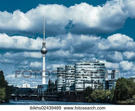 "View of the television tower and the office buildings of the Berliner Verkehrsbetriebe transport company on Holzmarktstrasse as seen from the banks of the Spree river, Berlin, Germany, Europe" View Large Photo Image Stock Photo - "View of the television tower and the office buildings of the Berliner Verkehrsbetriebe transport company on Holzmarktstrasse as seen from the banks of the Spree river, Berlin, Germany, Europe". Fotosearch