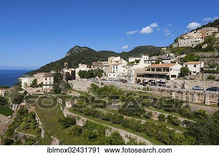 "View of the village of Banyalbufar, Serra de Tramuntana, Northwestern Coast, Mallorca, Majorca, Balearic Islands, Spain, Europe" View Large Photo Image Stock Image - "View of the village of Banyalbufar, Serra de Tramuntana, Northwestern Coast, Mallorca, Majorca, Balearic Islands, Spain, Europe". Fotosearch