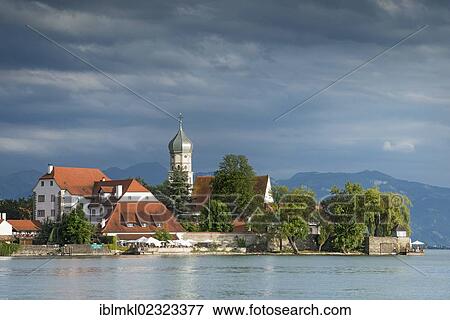 "View of Wasserburg peninsula with the baroque church of St. George as seen from the town of Nonnenhorn, Lake Constance, Bavaria, Germany, Europe" View Large Photo Image Stock Photo - "View of Wasserburg peninsula with the baroque church of St. George as seen from the town of Nonnenhorn, Lake Constance, Bavaria, Germany, Europe". Fotosearch