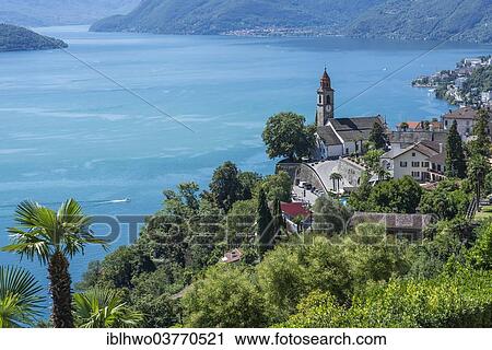 Stock Image - "View over a village towards Lake Maggiore or Lago Maggiore, Ronco sopra Ascona, Canton of Ticino, Switzerland, Europe". Fotosearch