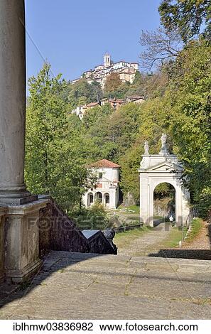 Stock Image - "View over Arco di San Ambrosio arch and Chapel X towards the Sanctuary of Santa Maria del Monte, historic pilgrimage route to the Sacro Monte di Varese or Sacred Mount of Varese, UNESCO World Cultural Heritage Site, Varese, Lombardy, Italy, Europe". Fotosearch