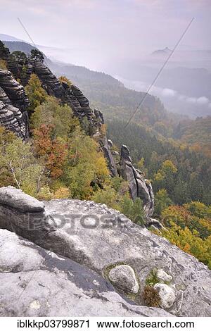 "View over Schrammsteine ​​the Elbe Sandstone Mountains, in the autumn, Saxon Switzerland, Bad Schandau, Saxony, Germany, Europe" View Large Photo Image Stock Image - "View over Schrammsteine ​​the Elbe Sandstone Mountains, in the autumn, Saxon Switzerland, Bad Schandau, Saxony, Germany, Europe". Fotosearch