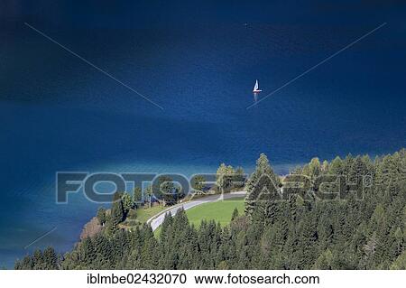 "View over the deep blue and clear waters of Weissensee lake, a mountain lake with drinking quality water, Carinthia, Austria, Europe" View Large Photo Image Stock Image - "View over the deep blue and clear waters of Weissensee lake, a mountain lake with drinking quality water, Carinthia, Austria, Europe". Fotosearch