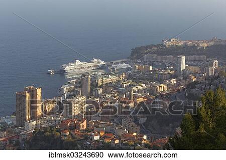 Stock Image - "View over the Principality of Monaco, """"Mein Schiff 1"""" docked in the port". Fotosearch