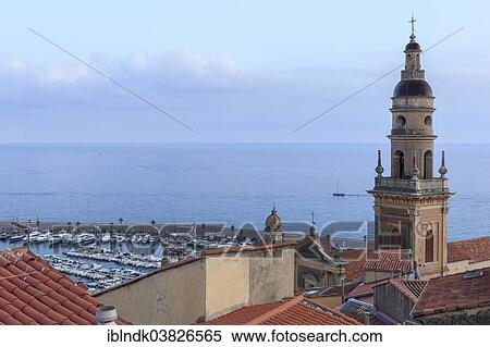 "View over the red rooftops towards Saint Michel Cathedral, Monastery of Menton, Menton, Provence-Alpes-Cote d’Azur, France, Europe" View Large Photo Image Stock Photography - "View over the red rooftops towards Saint Michel Cathedral, Monastery of Menton, Menton, Provence-Alpes-Cote d’Azur, France, Europe". Fotosearch